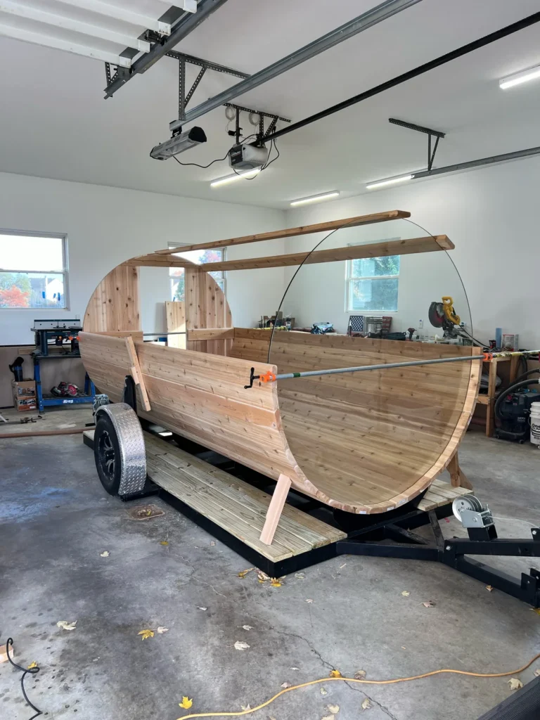 Building a custom trailer sauna: cedar staves going up on the trailer in the Sauna Craft shop