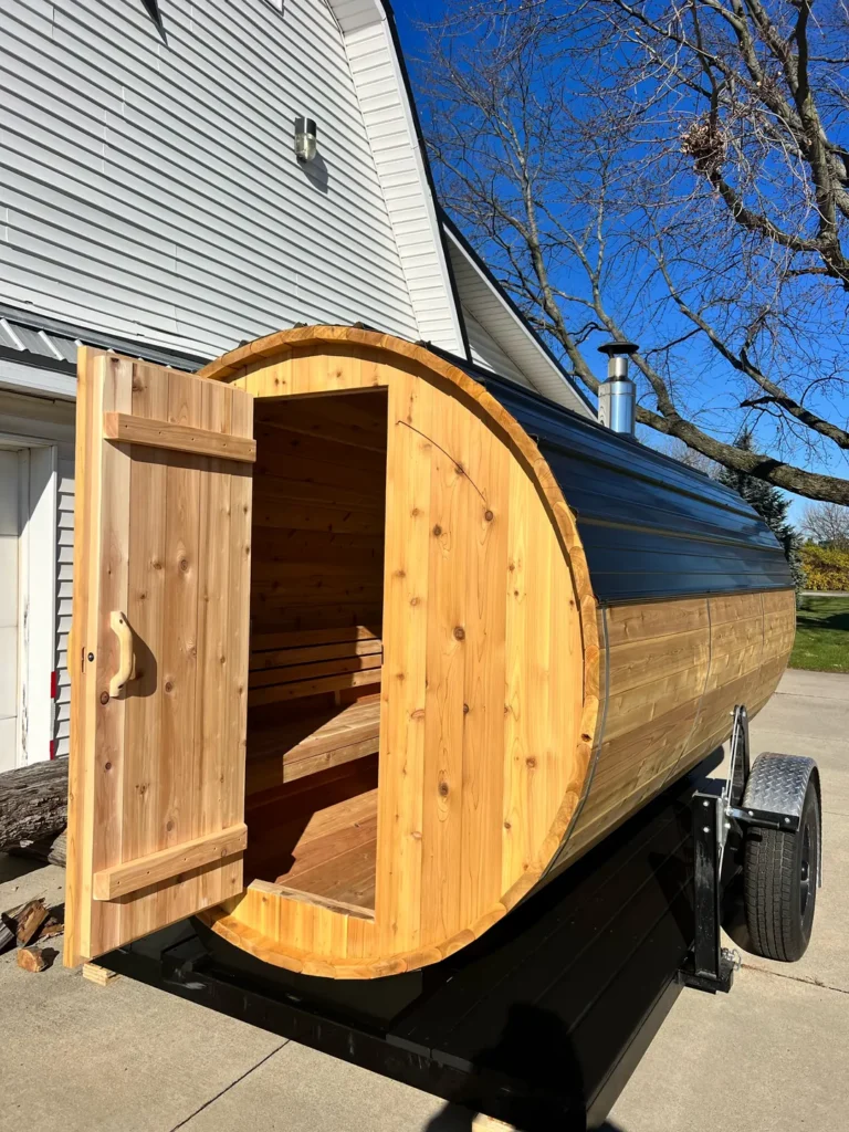 Cedar door open on the front end wall of the finished custom trailer sauna